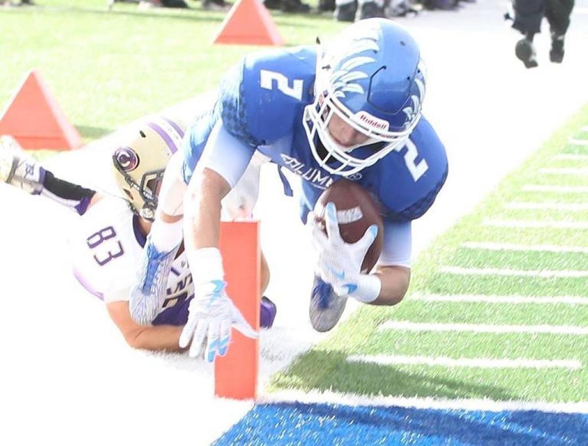 Columbia senior Jordan Holmes dives for the endzone during a playoff game in 2016. The 6-foot, 175 wide receiver took a pass on football and basketball scholarships at small schools to be a preferred walk-on at Illinois.