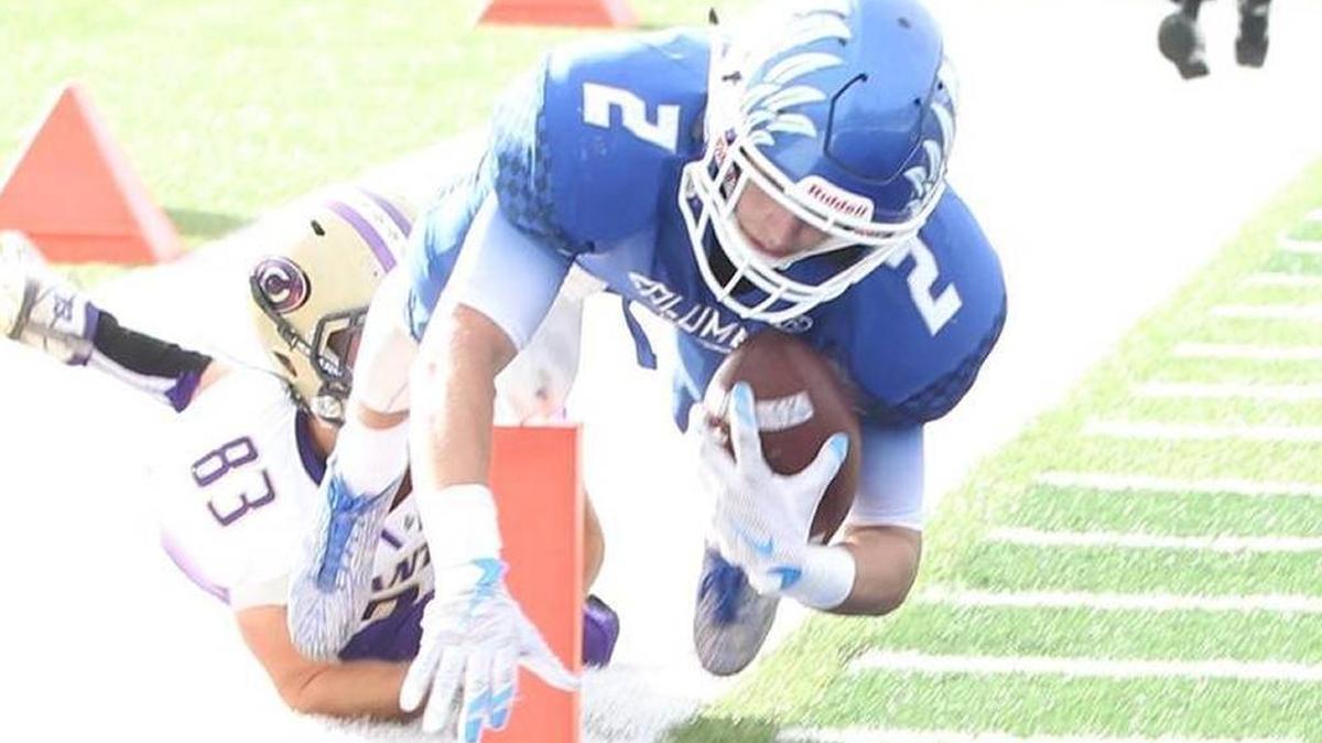 Columbia senior Jordan Holmes dives for the endzone during a playoff game in 2016. The 6-foot, 175 wide receiver took a pass on football and basketball scholarships at small schools to be a preferred walk-on at Illinois.