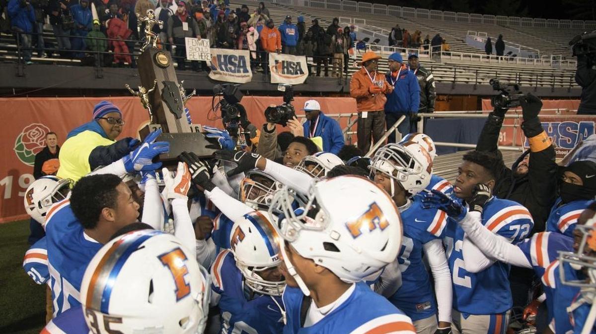East St. Louis players celebrate after defeating Plainfield North 26-13 in the IHSA Class 7A high school championship football game, Saturday, Nov. 26, 2016, at Memorial Stadium in Champaign.