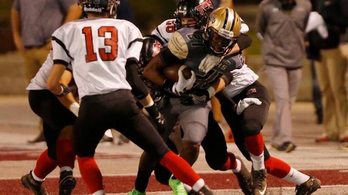 The Triad Knights defense, shown here against Althoff last week, will get another stuff test in the first round of the playoffs against Geneseo.