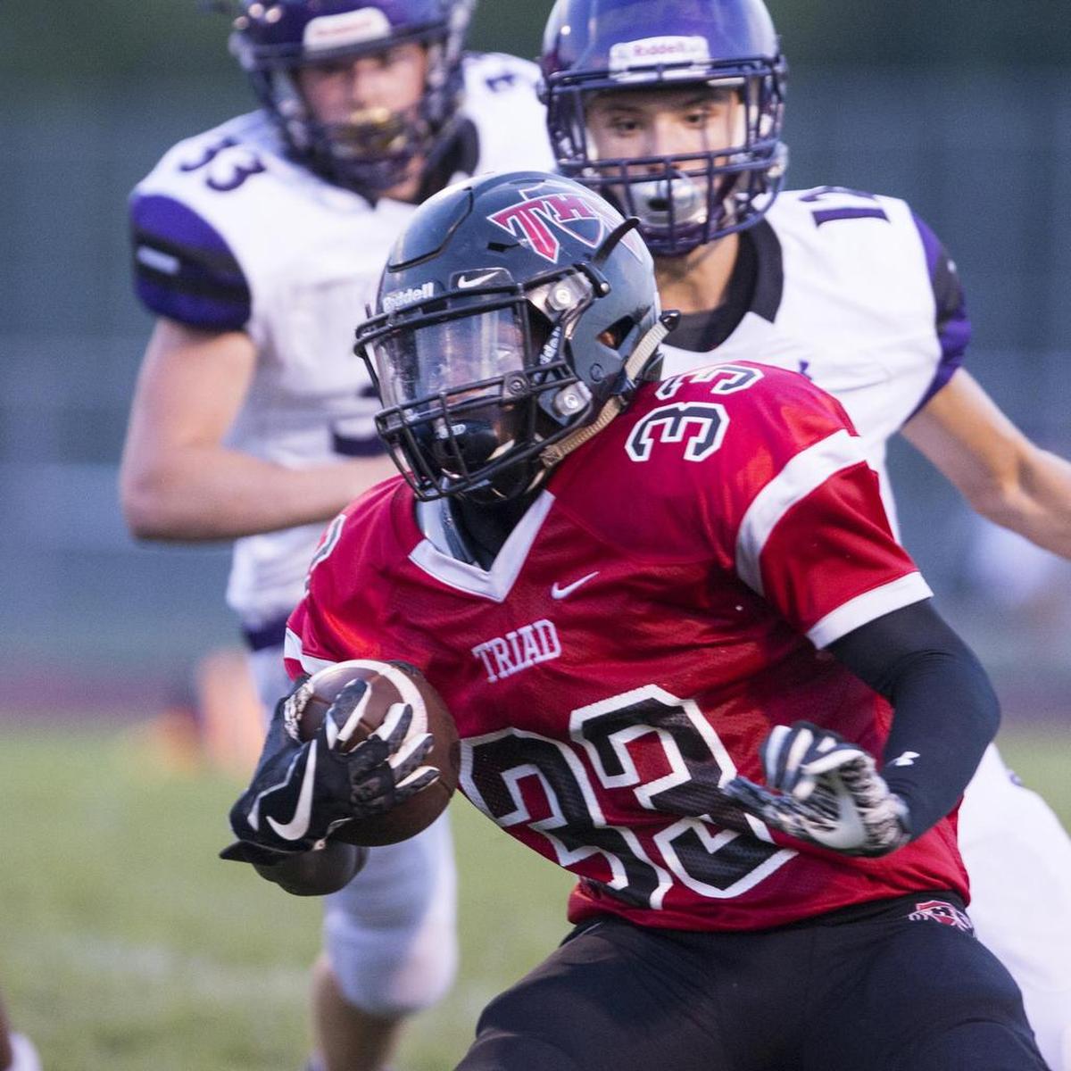 August 31, 2018 - Troy, IL - TriadÕs Amaziah Lusk carries the ball during the Collinsville - Triad Varsity football game Friday night in Troy. [Photo: Chris Johns]