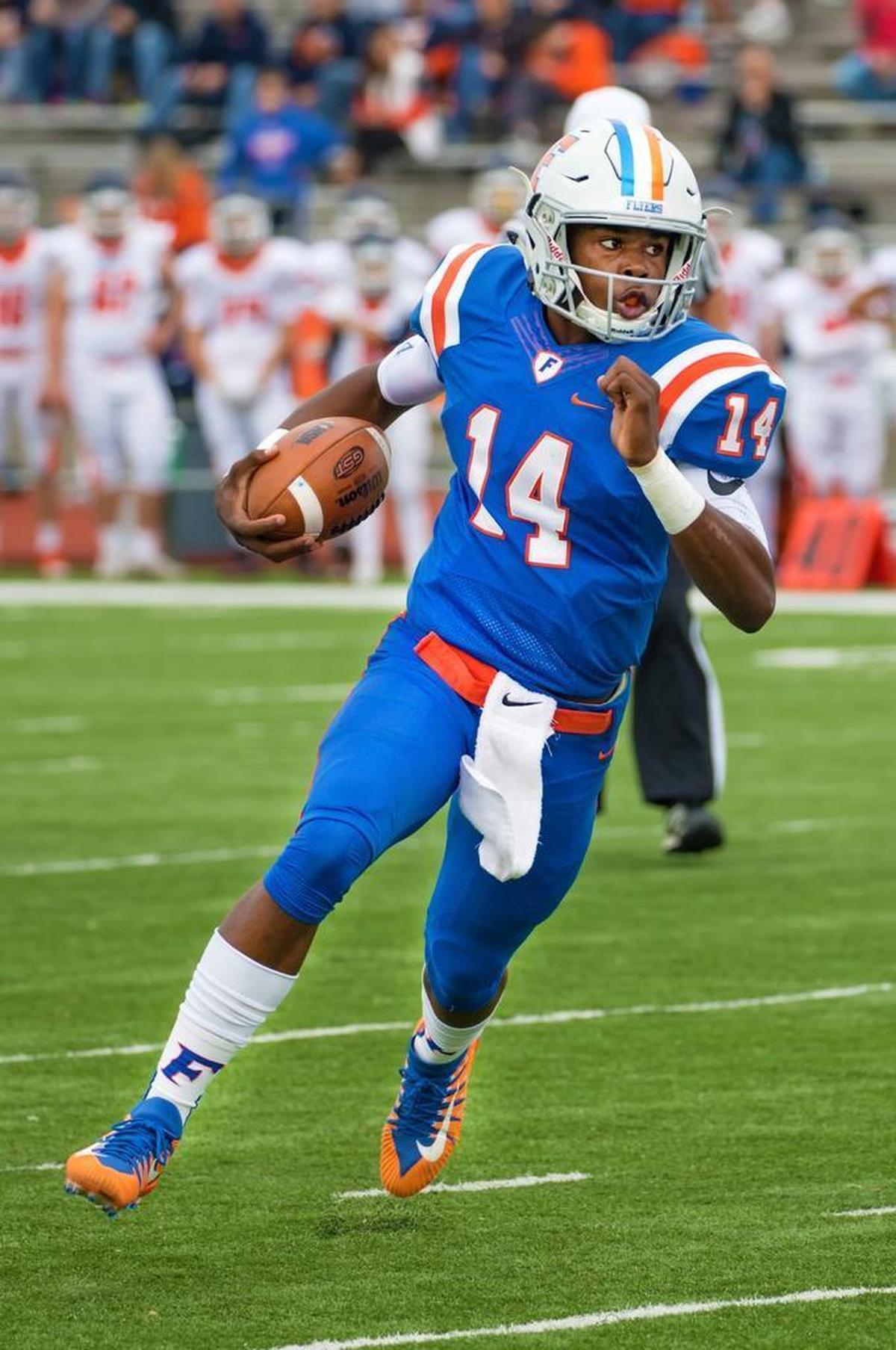 East St. Louis’ Eric Johnson runs the ball against Buffalo Grove during Saturday’s second-round playoff game at Clyde Jordan Stadium.