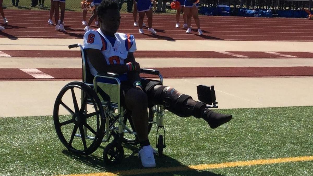 East St. Louis running back Jarrell Anderson watches from the sidelines as the Flyers play Belleville West on Saturday.
