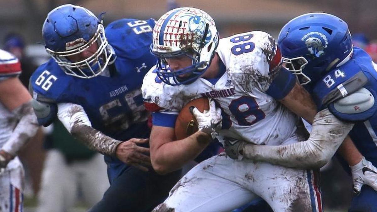 Nashville’s Royce Newman, No. 88, is sandwiched by Auburn defenders during the 2A state semifinal game on Saturday, Nov. 21, 2015. Newman, an offensive lineman, has committed to continuing his playing career at Mississippi State.