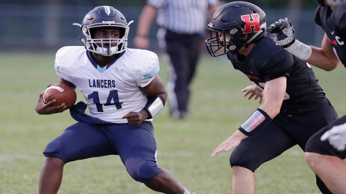 Belleville East quarterback Kienen Waller, No. 14, ranks third in the metro east with 1,621 passing yards through seven games.