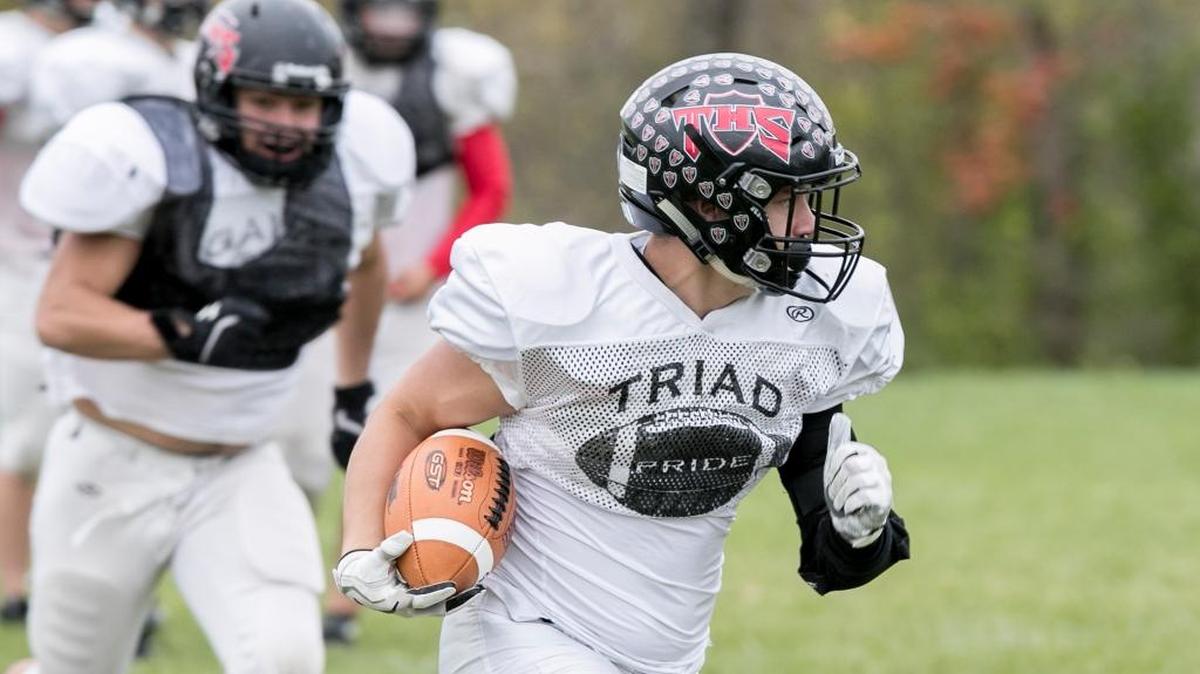 Triad running back Trevor Nott runs a route during practice.