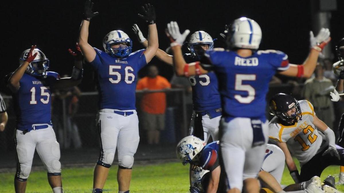 Nashville Hornets players Arturo Garcia (15), Derek Kirgan (56) and Grant Reed (5) celebrate a late touchdown Friday in the comeback win over Carlyle.