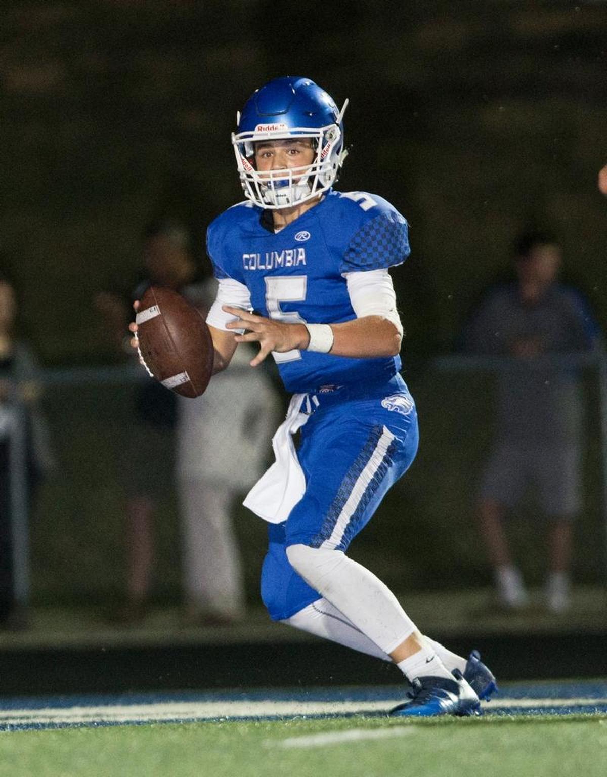 Columbia’s Nic Horner checks down field during the Columbia-Wesclin varsity football game at Columbia High School.