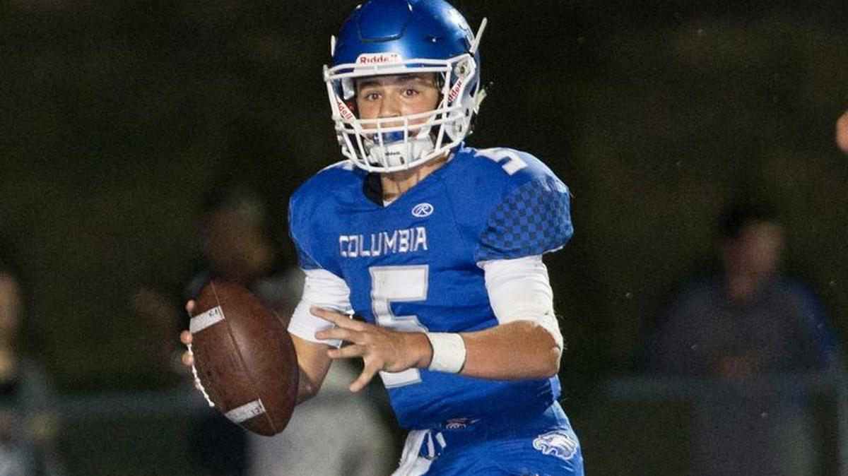 Columbia’s Nic Horner checks down field during the Columbia-Wesclin varsity football game at Columbia High School.