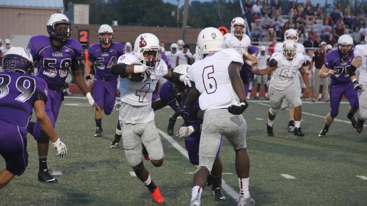 
Belleville West wide receiver TeAntez Anthony, No. 4, looks for room to run through the Collinsville defense.

