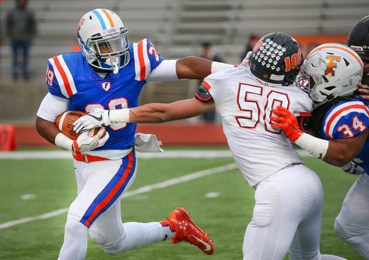East St. Louis’ Cam Rodgers in action against Libertyville during Saturday’s first-round playoff game at Clyde Jordan Stadium.