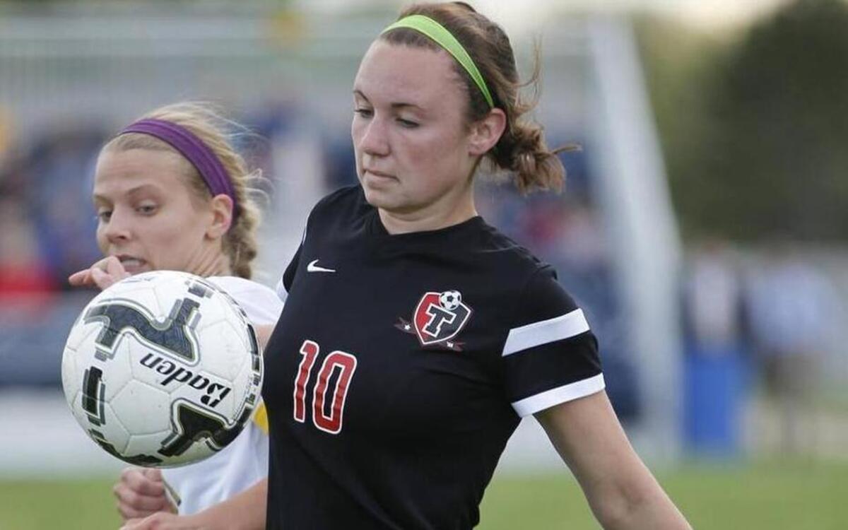 Triad's Meaghan Smith controls possession of the ball during a game against Althoff earlier this season. The Knights defeated Springfield Sacred Heart-Griffin to advance to the IHSA Class 2A State Tournament this weekend.