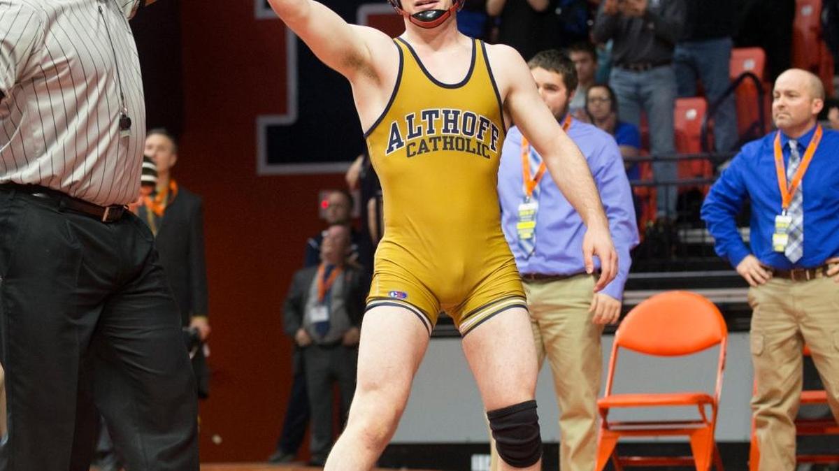 Althoff Catholic’s Danny Braunagel gets his hand raised after victory in the championship match at the Illinois High School Association state wrestling tournament in Champaign.