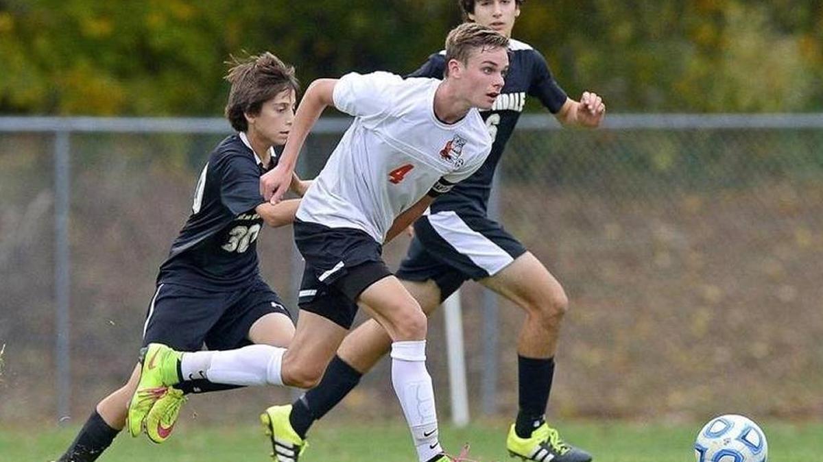 Waterloo midfielder Kane Osterhage (4) dribbles through the Carbondale defense during the 2A Boys Soccer Regional Final in October.