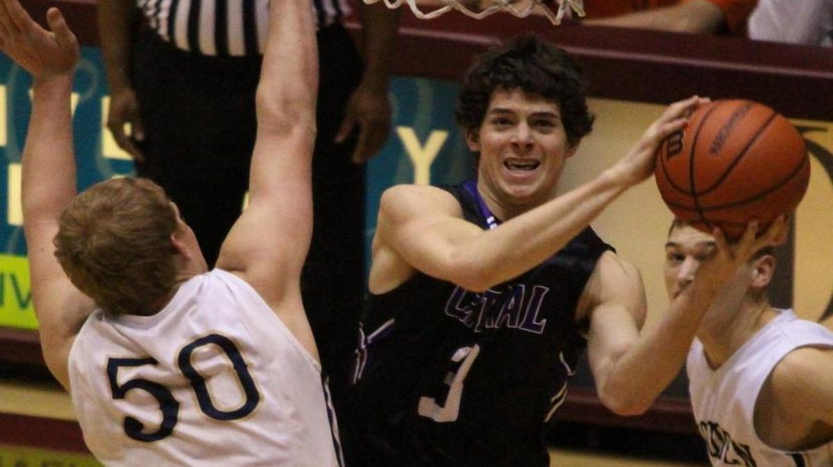 Central’s Logan Kohrmann puts up a shot against Teutopolis’ Brett Mette during the Class 2A Super-Sectional at the SIU Arena in Carbondale on Tuesday.