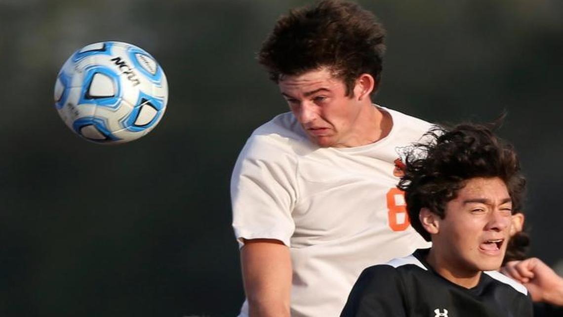 Waterloo’s Ben Huels, the BND Player of the Year, puts a header into the net against Carbondale to score his third goal a the Class 2A sectional game.