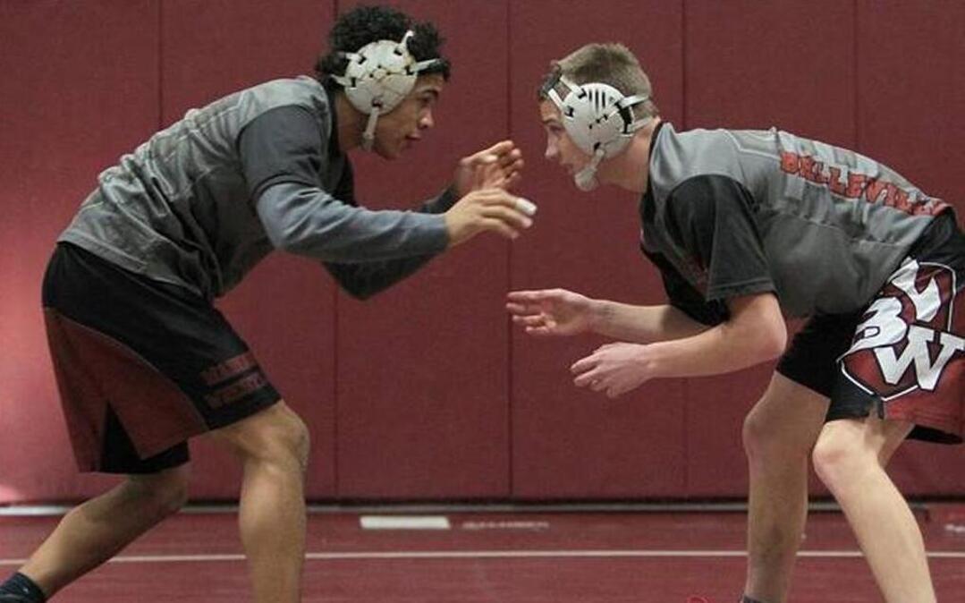 Belleville West senior Tristan Caswell, right, will be called upon to replace some of the leadership lost when three-year state medalist Nick Foster, left, graduated last season.