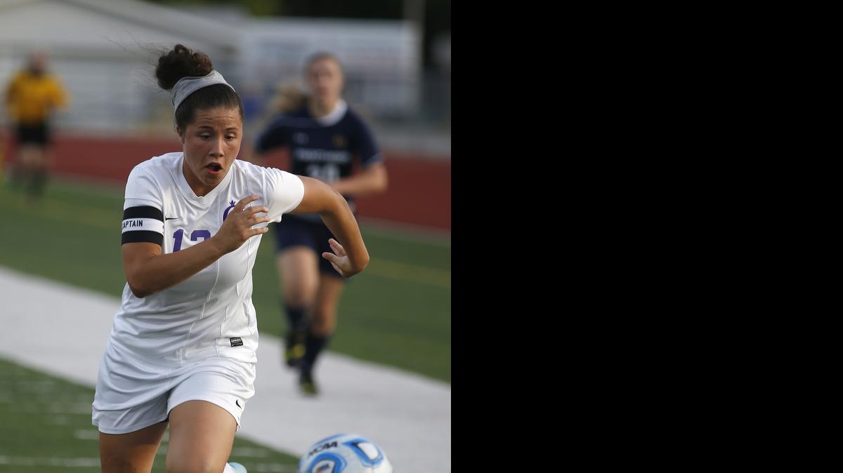 
Collinsville's Mikayla mCCarthy pulls away from an O'Fallon defender as she closes in on the ball during their Regional game on Friday at O'Fallon.
