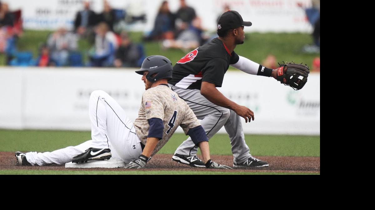 
The Grizzlies’ Madison Beard slides into a second for a double as Washington shortstop Jeudy Valdez awaits the ball during Sunday’s game at GCS Ballpark in Sauget.
