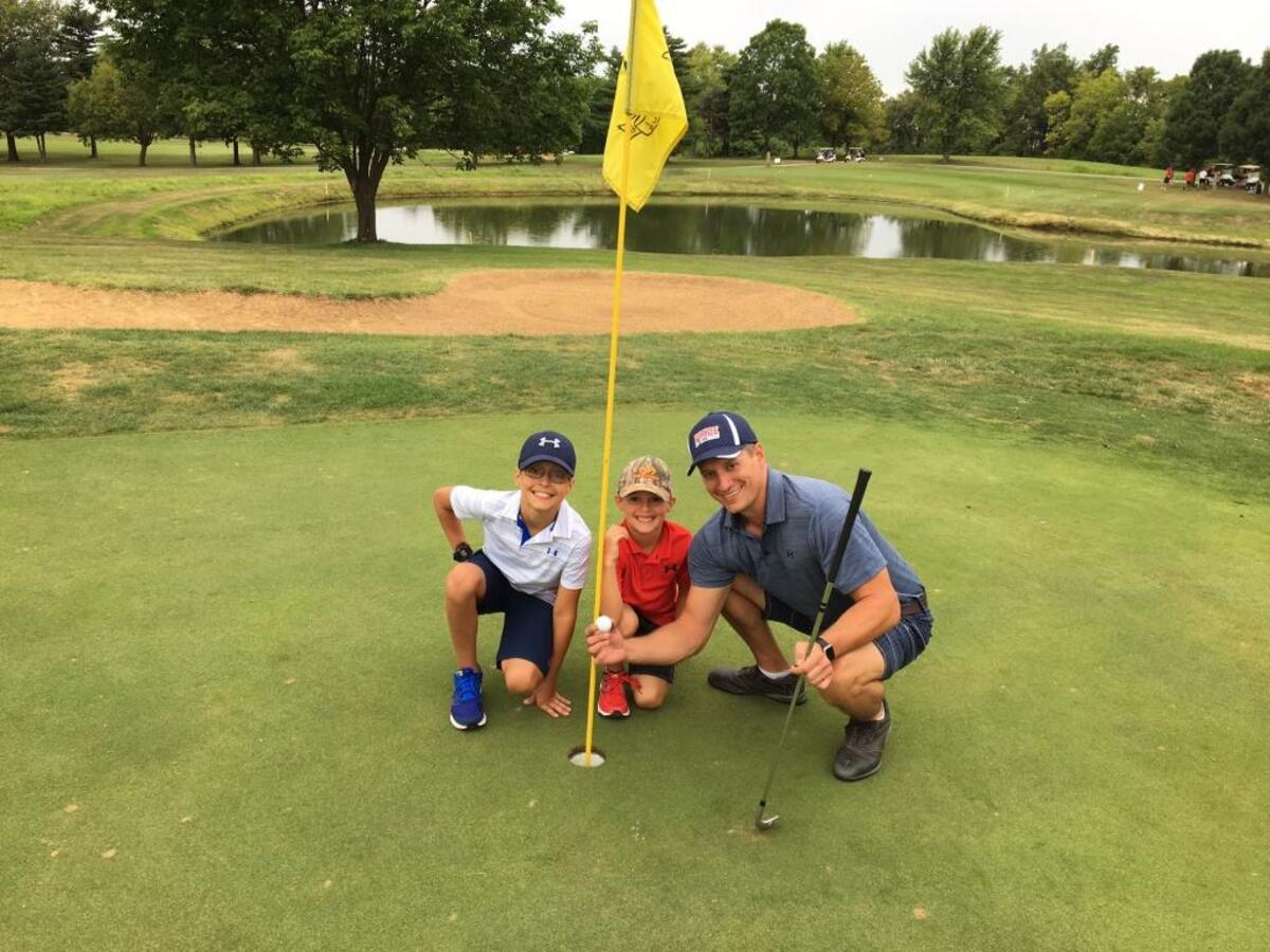 Matt Morris, 38, of Troy, got a hole-in-one Aug. 5 at Tamarack Golf Course in Shiloh as a participant in the Pride of Illinois Cheer, Gymnastics and Tumbling club benefit tournament. Morris celebrated with the other members of his foursome, which included sons Mason and Rhett.