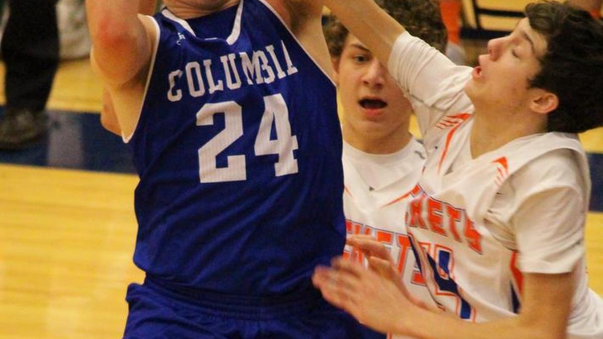 Columbia’s Jonathan Holmes handles the ball during Friday’s game against Okwaville.