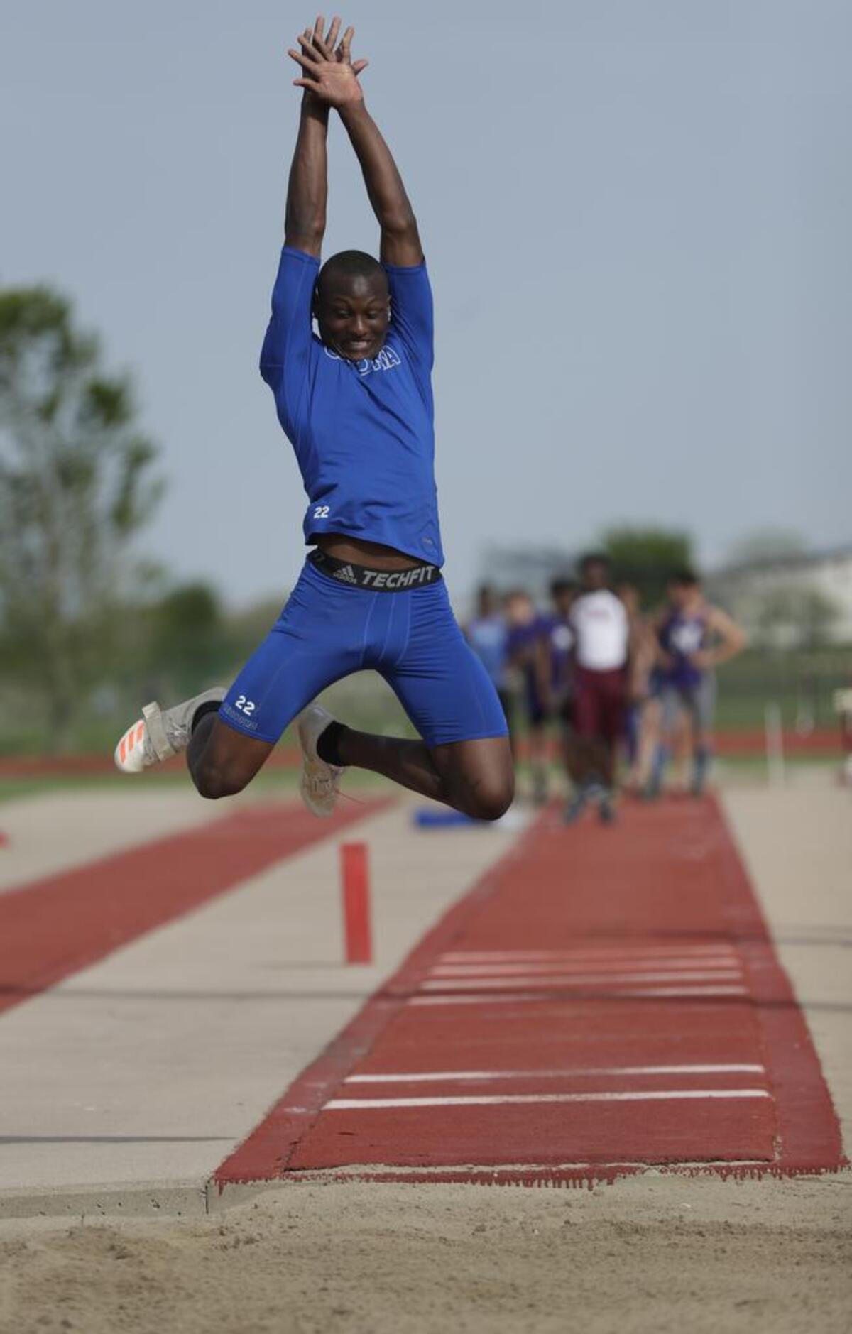 Cahokia's Andra Ward competes in the triple jump at the St. Clair County Boy's Track and Field Meet last spring.