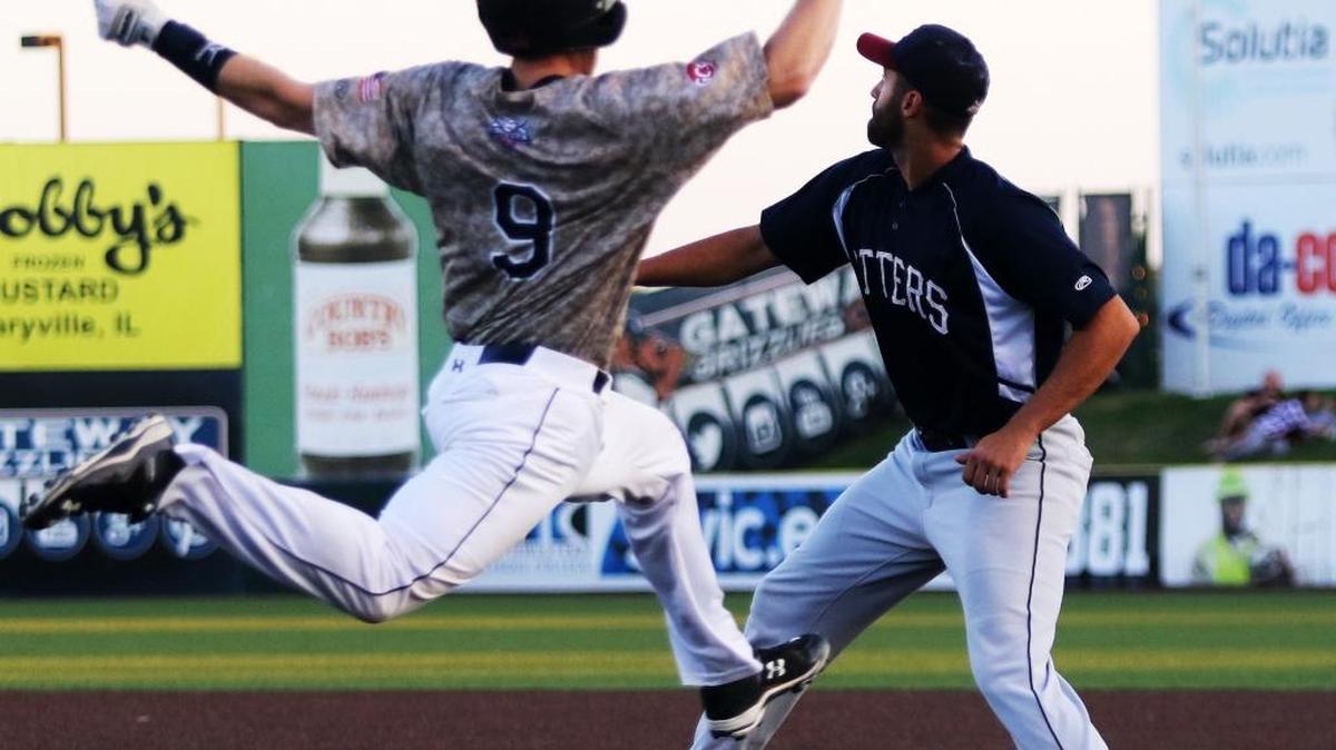 The Gateway Grizzlies’ Tyler Tewell leaps for first base and beats the throw for an infield single as the Evansville Otters’ Nik Balog awaits the throw Thursday. Gateway won 7-2. See a gallery of photographs at bnd.com.