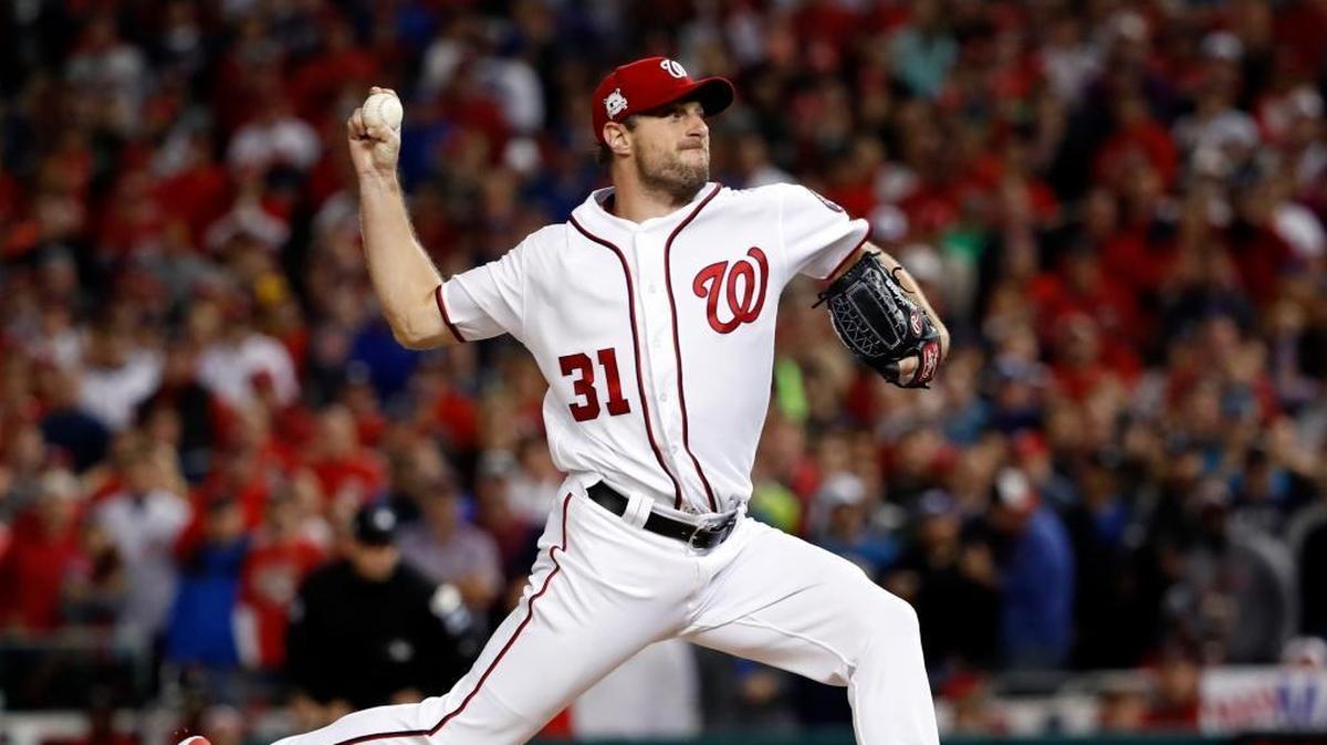 Washington Nationals pitcher Max Scherzer works during the fifth inning in Game 5 of the National League Division Series against the Chicago Cubs.