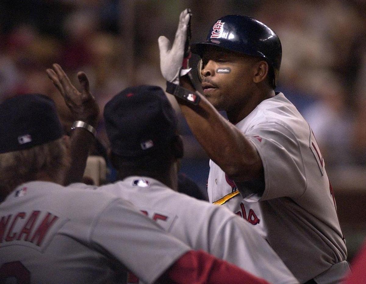 Ray Lankford is congratulated after hitting a solo home run in the third inning against the Arizona Diamondbacks Saturday, April 10, 2004 in Phoenix.