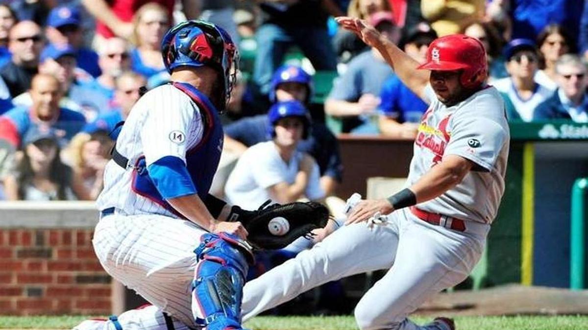 Cardinals shortstop Jhonney Peralta scores during a game last season in Chicago. The St. Louis shortstop is believed to have torn a ligament in his thumb and may miss the first two months of the season.