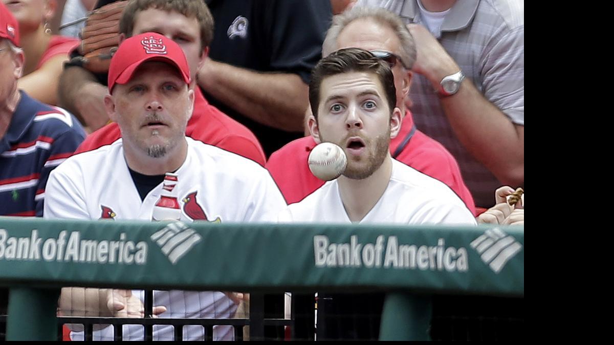 
Fans watch as a foul ball hit by the Cardinals' Kolten Wong heads their way during third inning Thursday at Busch Stadium.
