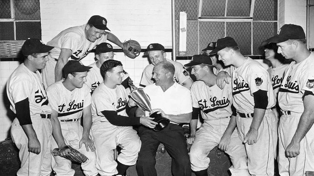 Bill Veeck, center, launched an all-out campaign to win over St. Louis baseball fans, as Cardinals’ owner Fred Saigh fought federal tax evasion charges. He would have succeeded, too, had Gussie Busch and the brewery not stepped in at the last minute to save the Redbirds from a move to Houston in 1952.
