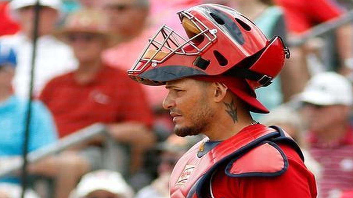 Will the Cardinals, led by Gold Glove catcher Yadier Molina and manager Mike Matheny (background), defend their NL Central title in 2016?