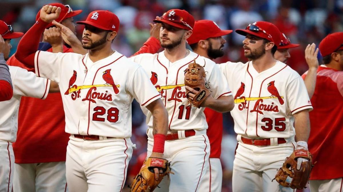 Tommy Pham (28), Paul DeJong (11) and Greg Garcia (35) celebrate with teammates after defeating the Milwaukee Brewers on Saturday in St. Louis. Pham and DeJong made major contributions this season as the Cardinals finished 83-79.