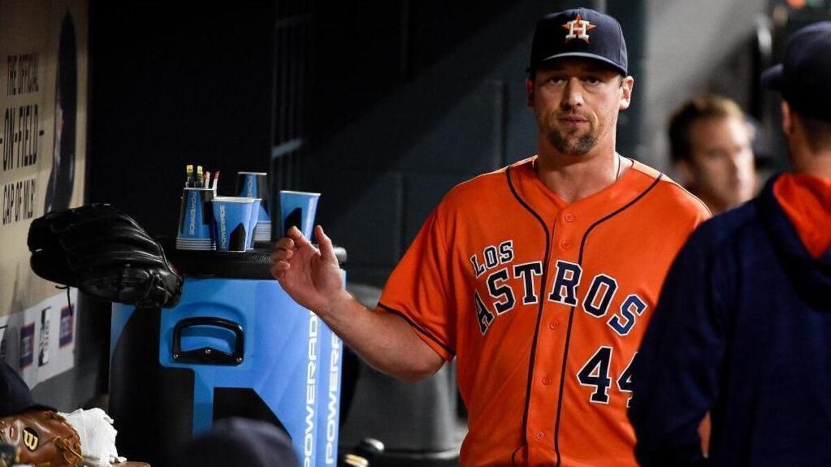 Houston Astros relief pitcher Luke Gregerson throws his glove in the dugout after being removed from the baseball game in 2016.