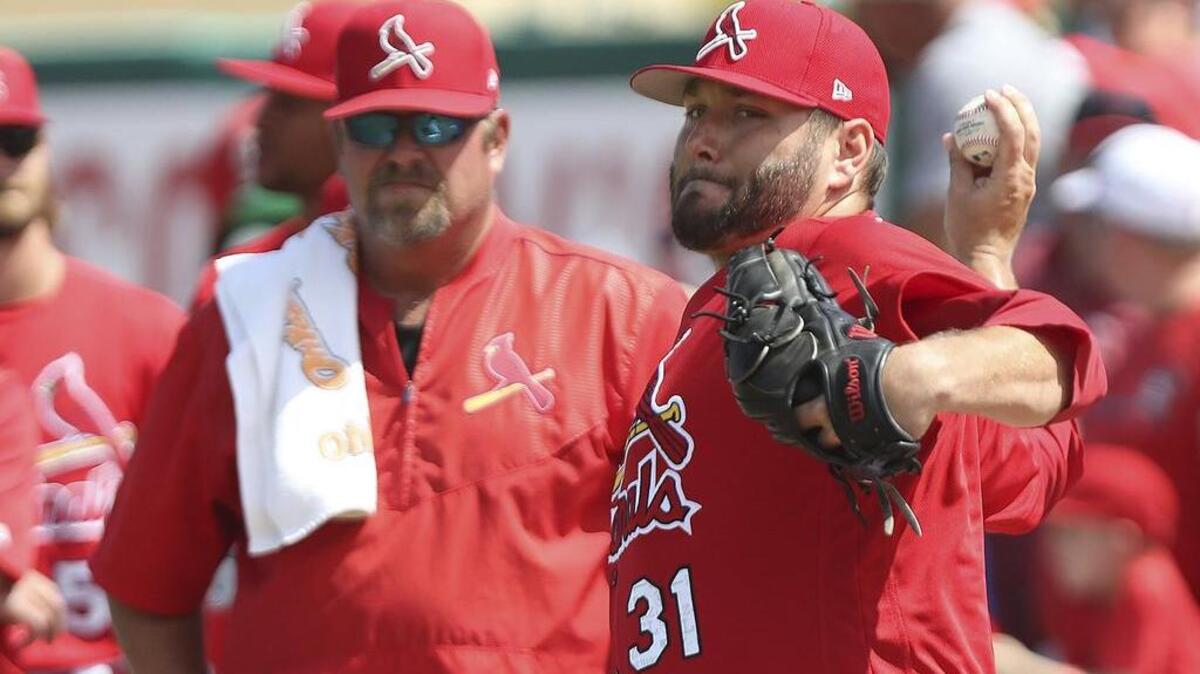 St. Louis Cardinals pitcher Lance Lynn warms up for the spring training game against the Houston Astros.