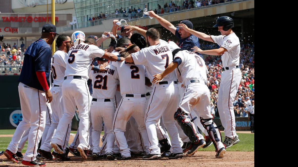 
The Twins’ Kennys Vargas,gets water poured on him after his walk off home run off Cardinals relief pitcher Carlos Villanueva during the bottom of the ninth inning Thursday in Minneapolis. The Twins won 2-1.
