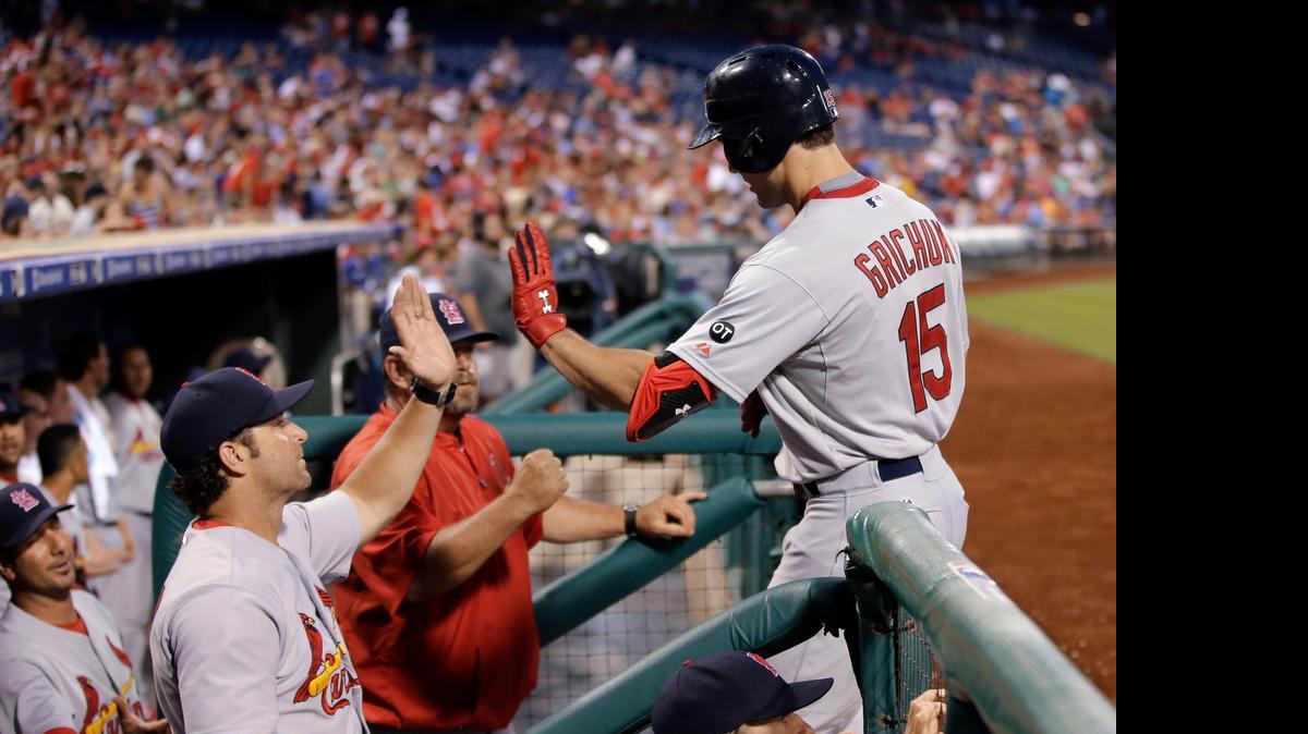 
The Cardinals’ Randal Grichuk returns to the dugout after hitting a three-run home run off the Phillies’ Aaron Harang during the sixth inning.

