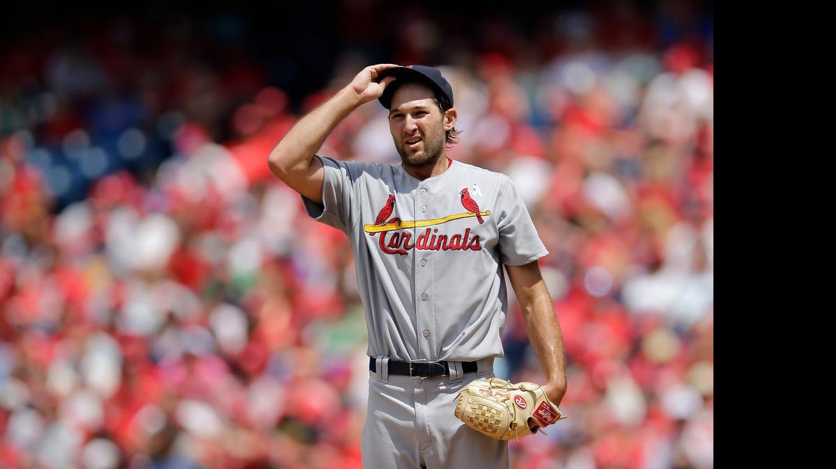
Cardinals pitcher Michael Wacha adjusts his cap after giving up a two-run single to the Phillies' Cesar Hernandez during the second inning Sunday in Philadelphia. Wacha allowed five runs in five innings and took the loss in a game won by the Phillies’ 9-1.

