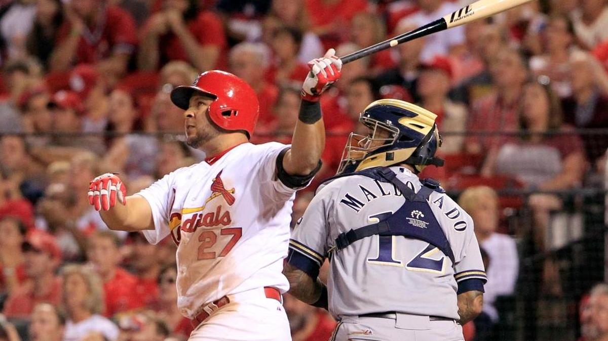 
The Cardinals’ Jhonny Peralta watches his three-run home run along with Brewers catcher Martin Maldonado during the fourth inning Thursday at Busch Stadium.
