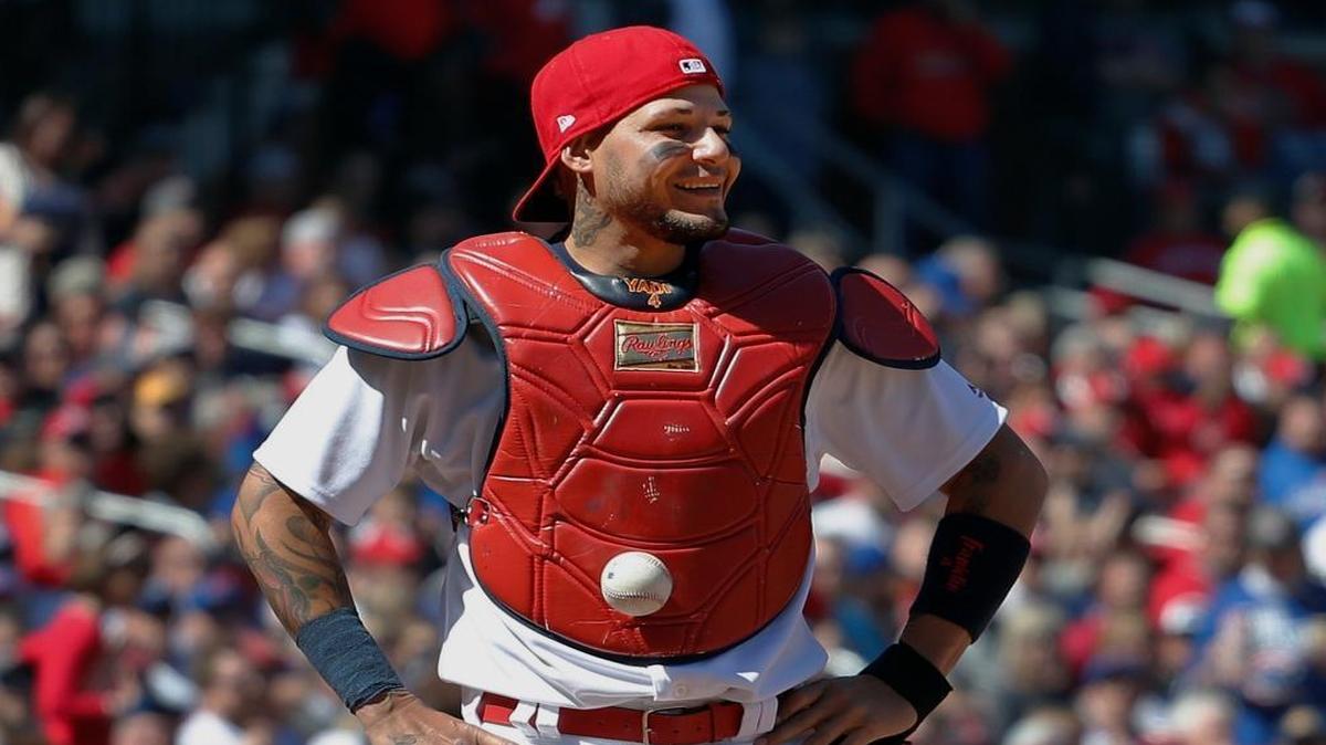 St. Louis Cardinals catcher Yadier Molina stands with his hands on his hips as a ball is somehow stuck to his chest protector during the seventh inning of a baseball game against the Chicago Cubs on Thursday in St. Louis. The ball was stuck to Molina's chest protector on a dropped third strike allowing the Cubs' Matt Szczur to reach first base when Molina couldn't find the ball.