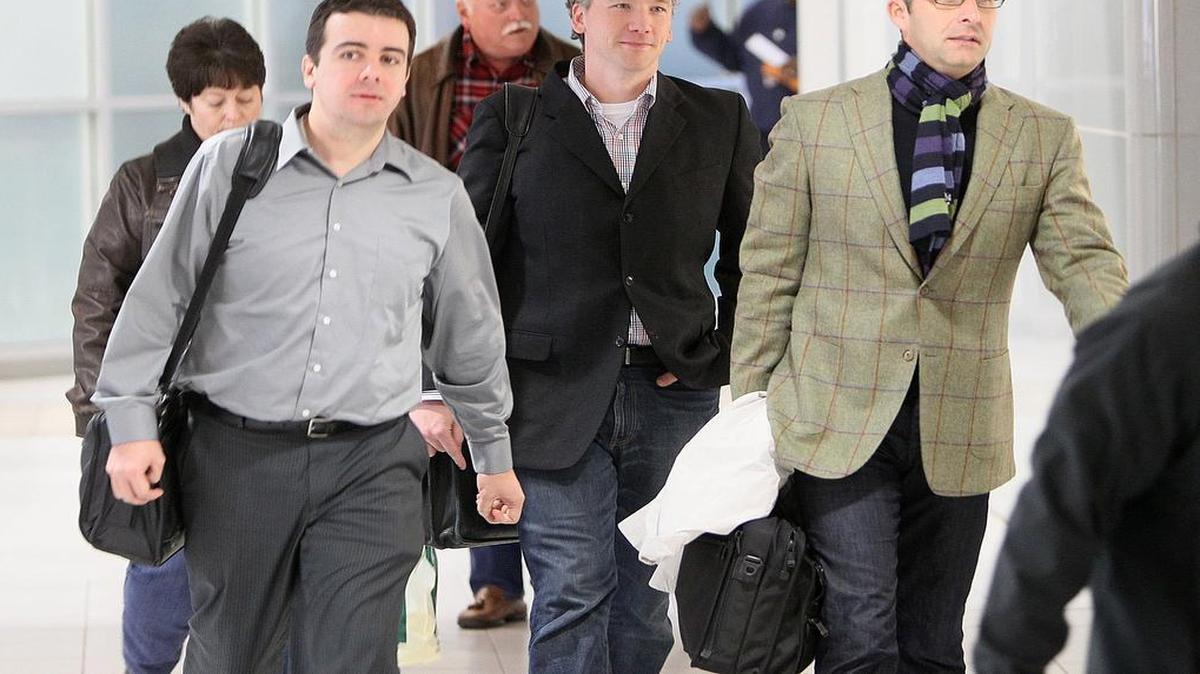 In this 2011, photo, then-St. Louis Cardinals scouting director Christopher Correa, left, assistant general manager Mike Girsch and general manager John Mozeliak arrive at Lambert-St. Louis International Airport in St. Louis from the baseball winter meetings in Dallas. The former scouting director of the St. Louis Cardinals has pleaded guilty in federal court to hacking the Houston Astros' player personnel database. Christopher Correa pleaded guilty Friday to five counts of unauthorized access of a protected computer, access authorities said dated back several years. The 35-year-old Correa was the Cardinals’ director of baseball development until he was fired last summer.