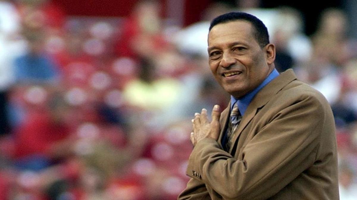 
Former St. Louis Cardinals pitcher Joaquin Andujar gestures to the crowd and the Cardinal dugout before throwing his ceremonial first pitch before a game in 2003. Andujar died Tuesday at the age of 62.

