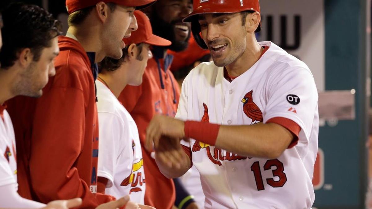 
The Cardinals’ Matt Carpenter is congratulated in the dugout after hitting his second two-run home run of the game in the fifth inning Wednesday against the Reds at Busch Stadium. Carpenter also homered in the third inning. The Cardinals won 10-2.

