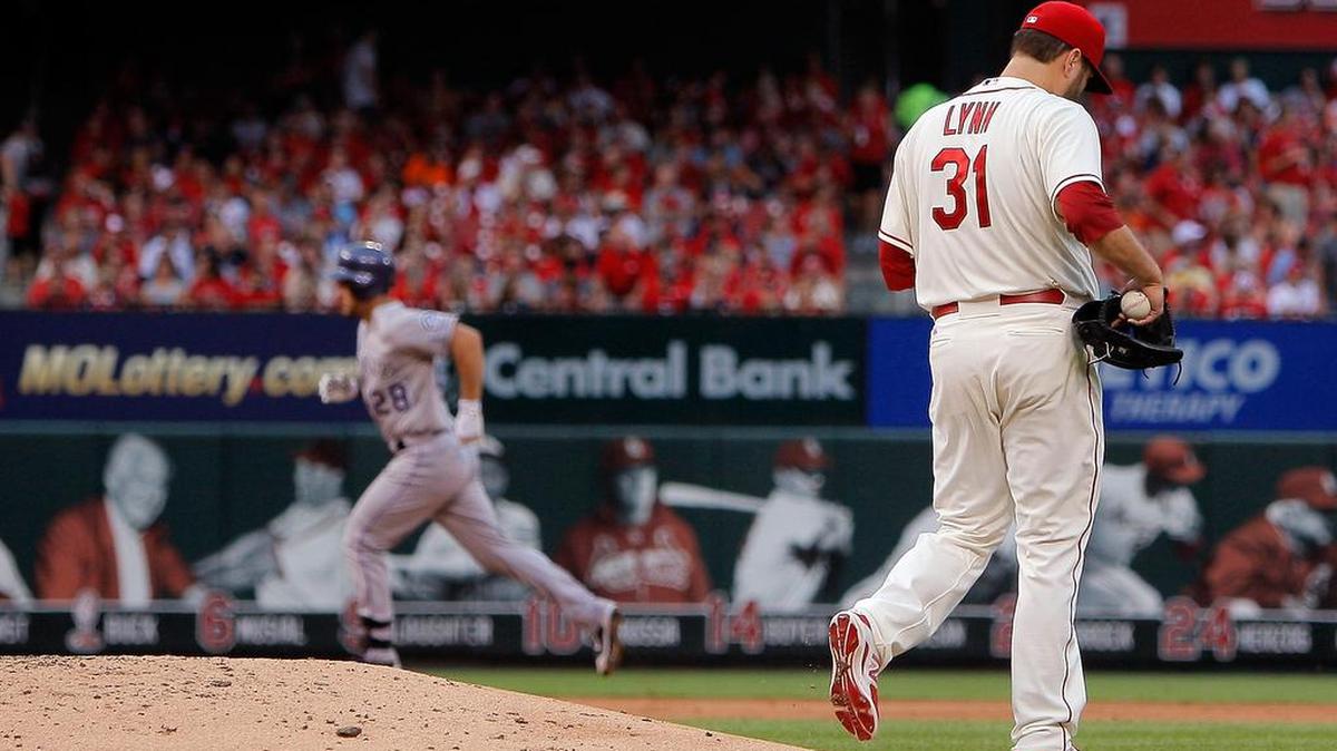 
Cardinals pitcher Lance Lynn walks off the mound as the Rockies’ Nolan Arenado runs the bases after hitting a two-run home run during the fourth inning Saturday at Busch Stadium. The Rockies won 6-2.
