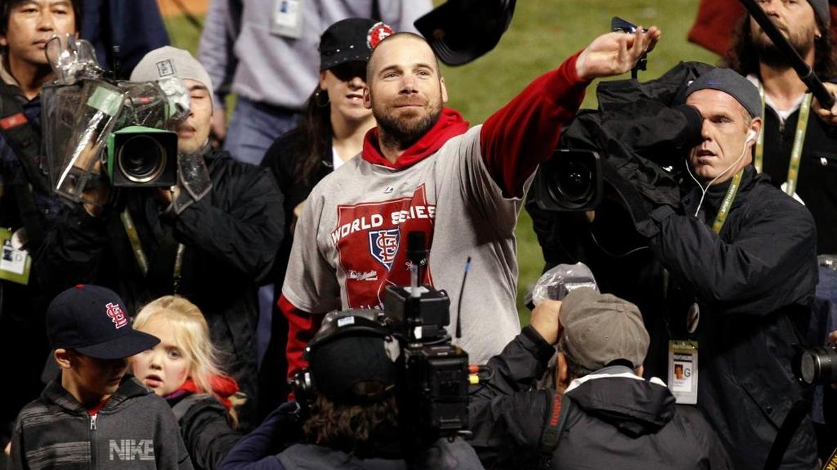 St. Louis Cardinals pitcher Chris Carpenter throws his hat in the stands after a 6-2 triumph over the Texas Rangers in Game 7 at Busch Stadium in St. Louis back in 2011. Carpenter and catcher, third baseman, first baseman and manager Joe Torre were elected to the St. Louis Cardinals Hall of Fame on Friday after online balloting by fans.