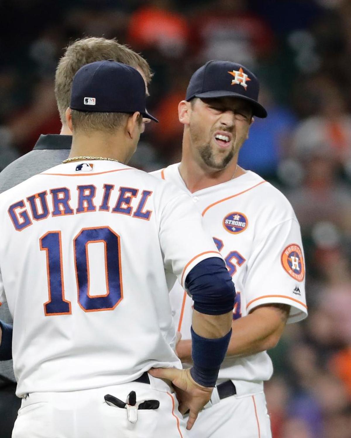 Houston Astros' Luke Gregerson, right, is checked after being hit by a Chicago White Sox's Tim Anderson hit during the eighth inning of a baseball game Sept. 20 in Houston. The Cardinals signed him as a free agent on Dec. 14.