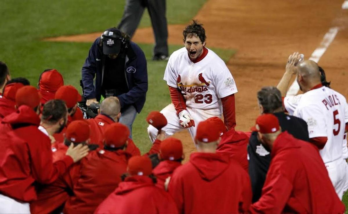 David Freese arrives at home plate after hitting his game-winning home run in the 11th inning of Game 6 of the 2011 World Series. The St. Louis Cardinals defeated the Texas Rangers 7-6 that night – Oct. 27, 2011 – and won the Series with a 6-2 victory in Game 7 the next night.