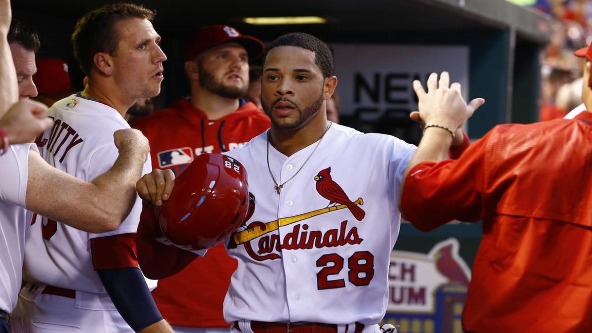 St. Louis’ Tommy Pham is congratulated by teammates after scoring a run last season. Pham was dealt to the Tampa Bay Rays for three minor-league players Tuesday.