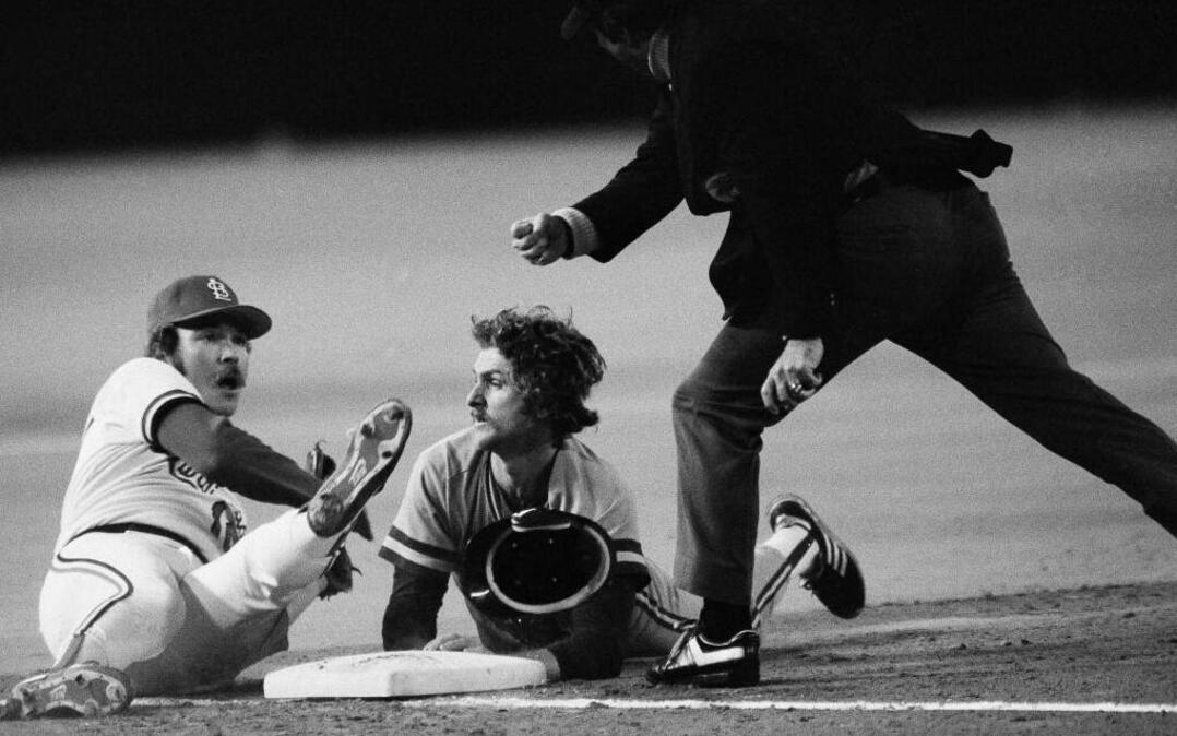 Milwaukee Brewers runner Robin Yount, center, and St. Louis Cardinals third baseman Ken Oberkfell, left, get the out call from umpire Dave Phillips, right, after colliding at third in the fourth inning of Game 7 of the 1982 World Series.